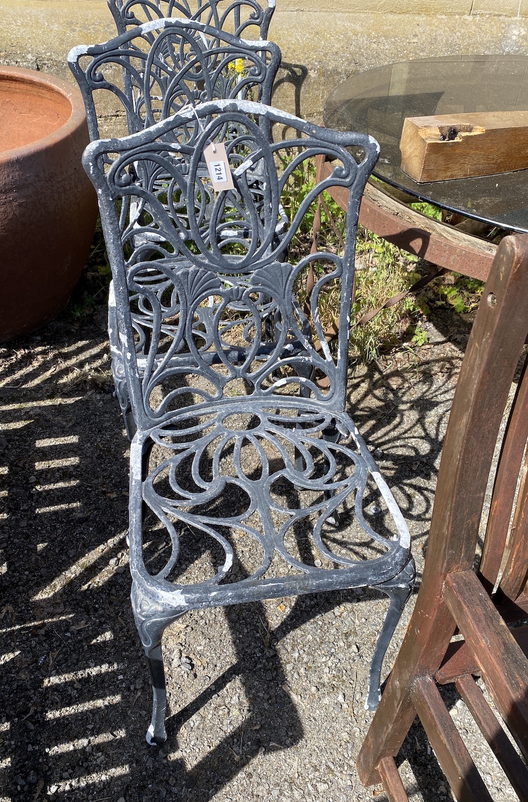 A set of four painted aluminium garden chairs